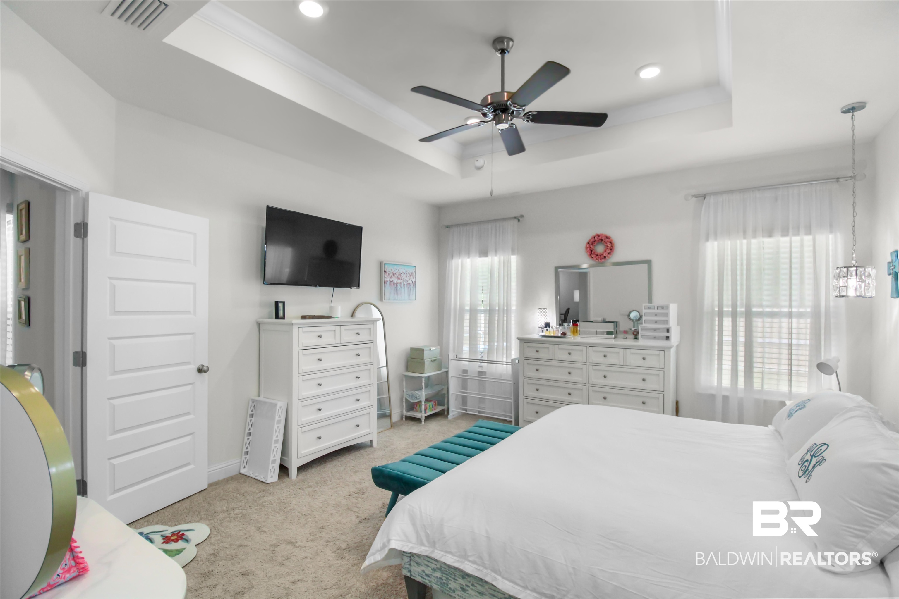 1885 Carly Street Foley, AL 36535 - Photo 17 of 40 Spacious room featuring a tray ceiling, recessed lighting, and a ceiling fan