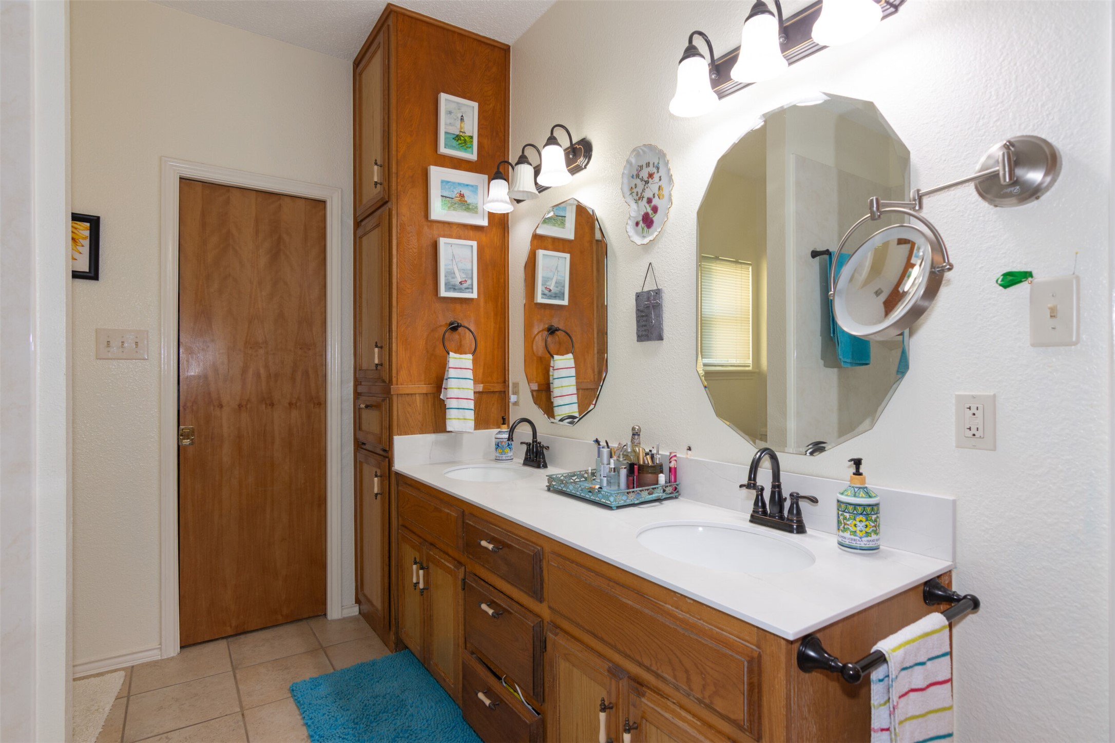 219 Turtle Bend Georgetown, TX 78628 - Photo 25 of 37 Ample built-in storage and dual sinks anchor this functional bathroom space with walk in closet.
