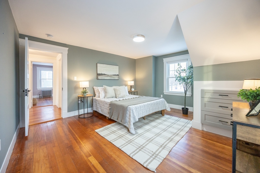 42 York Street Andover, MA 01810 - Photo 15 of 35 a spacious bedroom with a bed and wooden floor