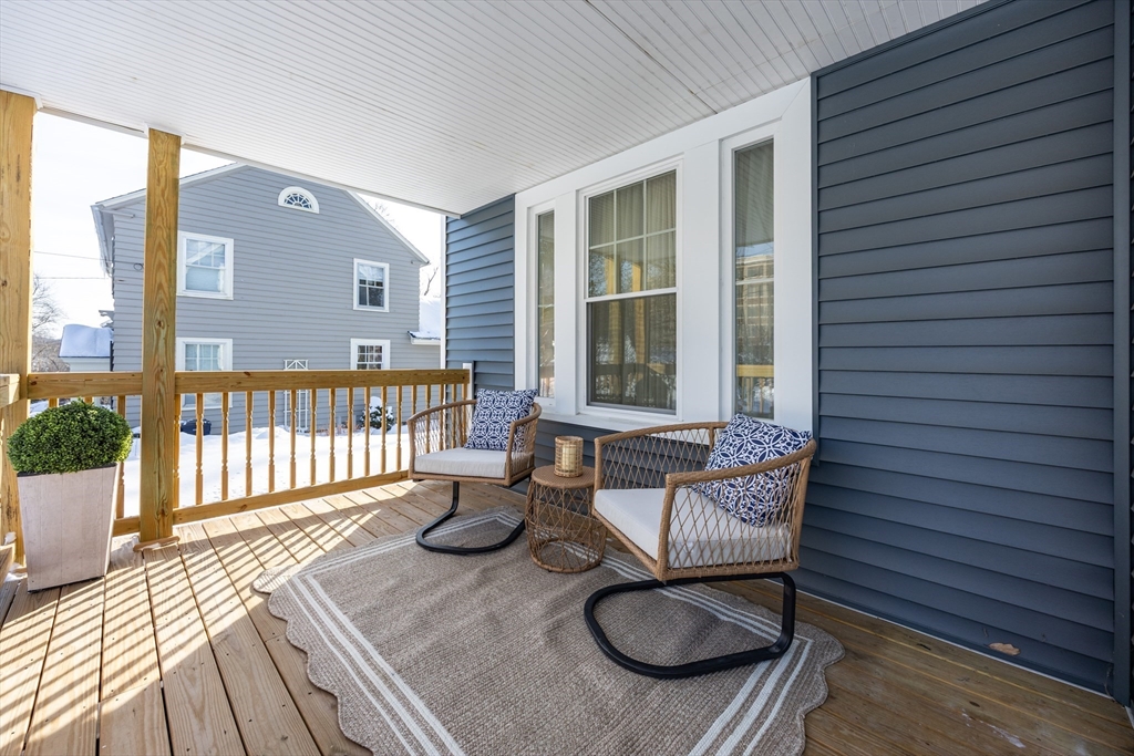 42 York Street Andover, MA 01810 - Photo 2 of 35 a balcony with table and chairs
