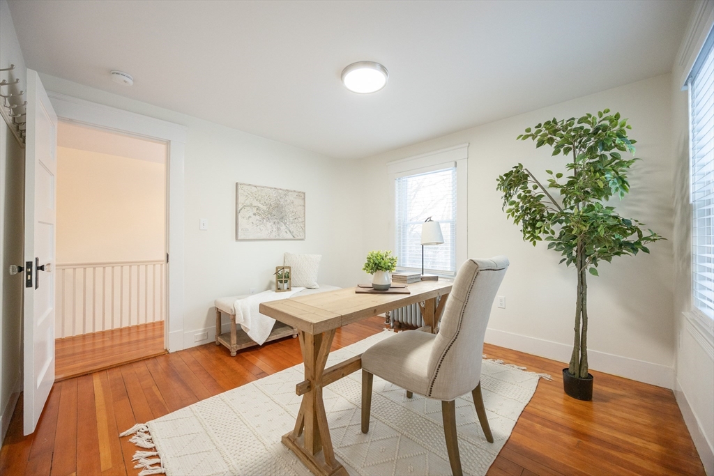 42 York Street Andover, MA 01810 - Photo 22 of 35 a view of a livingroom with furniture and a potted plant