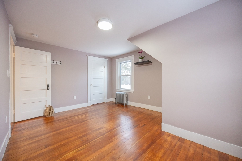 42 York Street Andover, MA 01810 - Photo 24 of 35 wooden floor in an empty room with a window