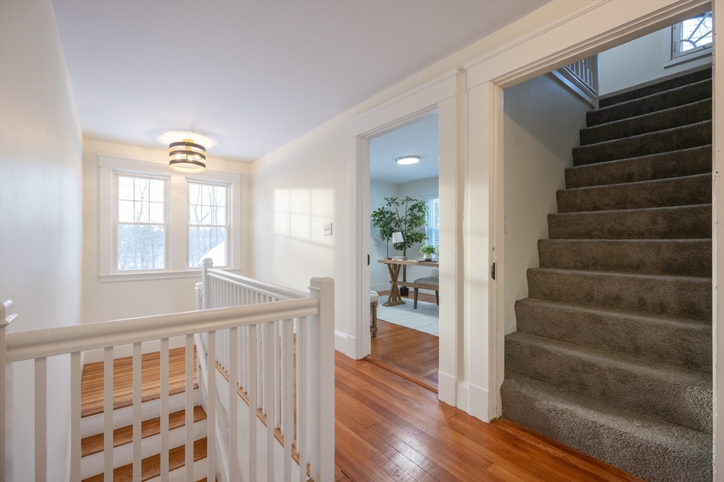 42 York Street Andover, MA 01810 - Photo 25 of 35 a view of entryway with wooden floor and stairs