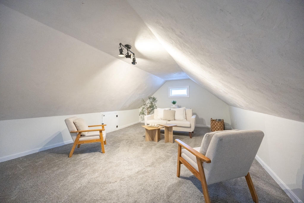 42 York Street Andover, MA 01810 - Photo 26 of 35 a living room with chairs and a table