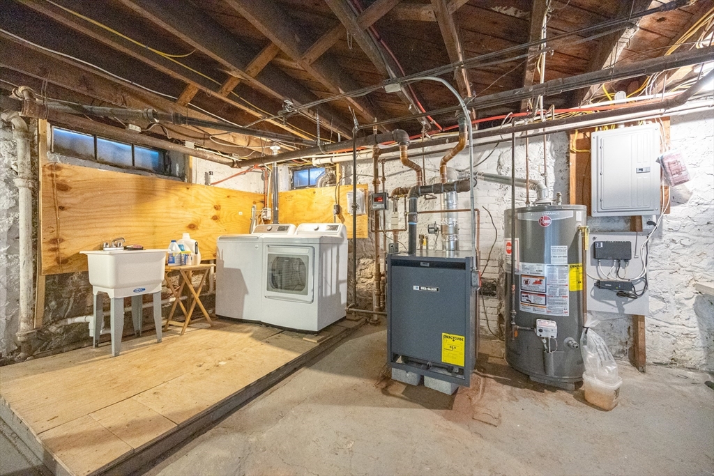 42 York Street Andover, MA 01810 - Photo 30 of 35 a view of a storage room with washer and dryer