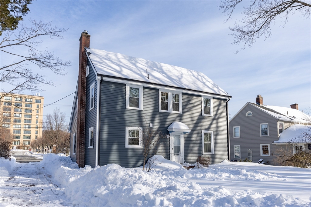 42 York Street Andover, MA 01810 - Photo 31 of 35 a view of a house with a snow in the yard