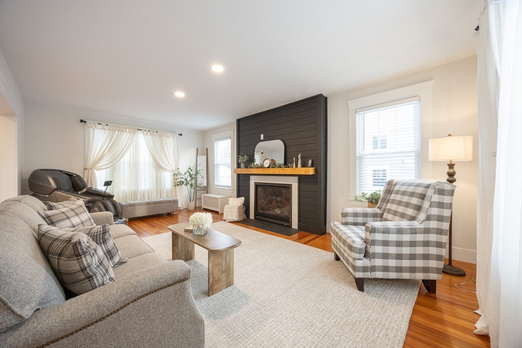 42 York Street Andover, MA 01810 - Photo 4 of 35 a living room with furniture and a fireplace