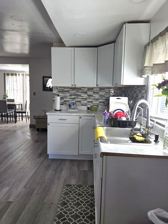 56 Montclair Street Springfield, MA 01104 - Photo 2 of 8 a kitchen with a sink stove and cabinets