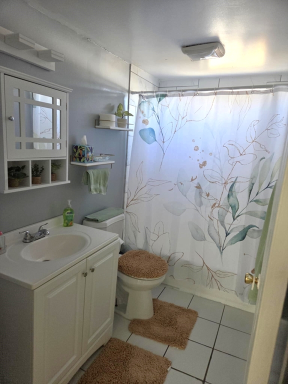 56 Montclair Street Springfield, MA 01104 - Photo 4 of 8 a bathroom with a sink toilet and shower