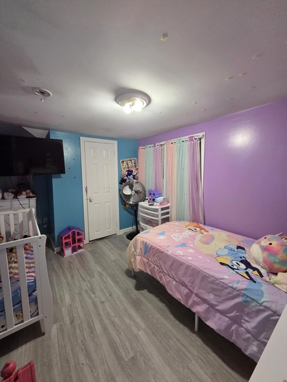 56 Montclair Street Springfield, MA 01104 - Photo 5 of 8 a bedroom with bed and a window