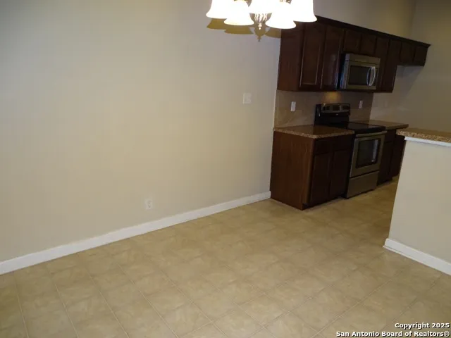 a kitchen with a cabinets and a stove