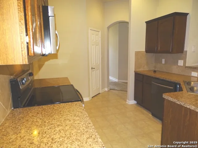 a bedroom with a bed and cabinets