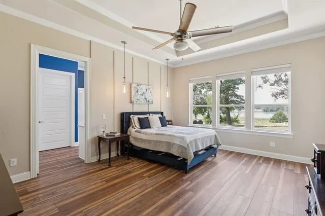 a spacious bedroom with a bed and a window