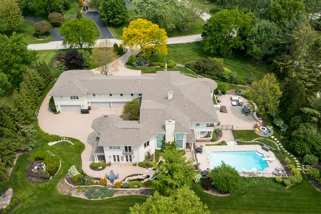 an aerial view of a house with garden space ocean view