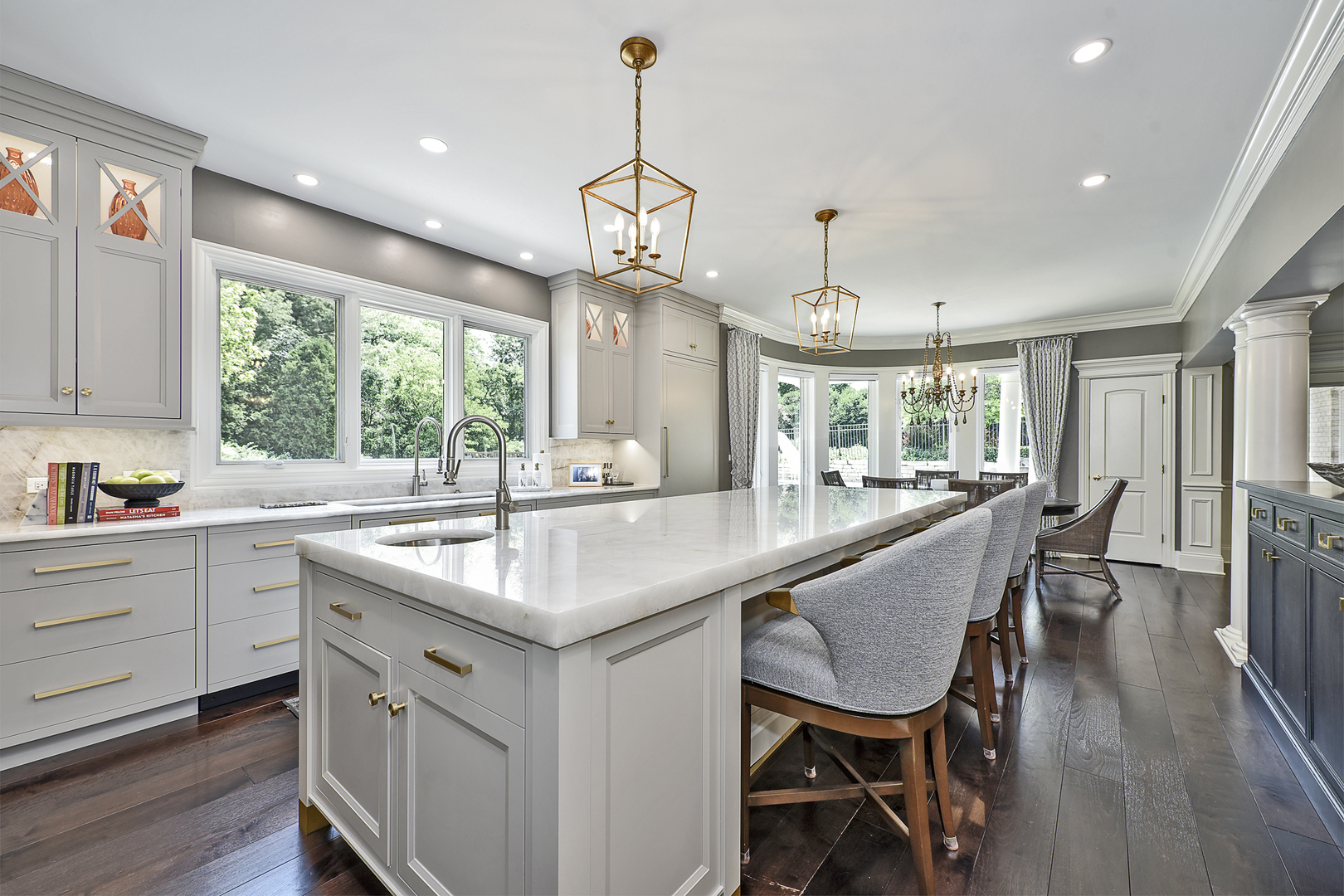 1877 Banbury Road Inverness, IL 60067 - Photo 11 of 59 a kitchen with kitchen island a dining table chairs sink and wooden floor