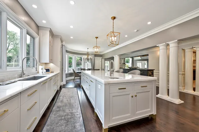 a living room with furniture and wooden floors