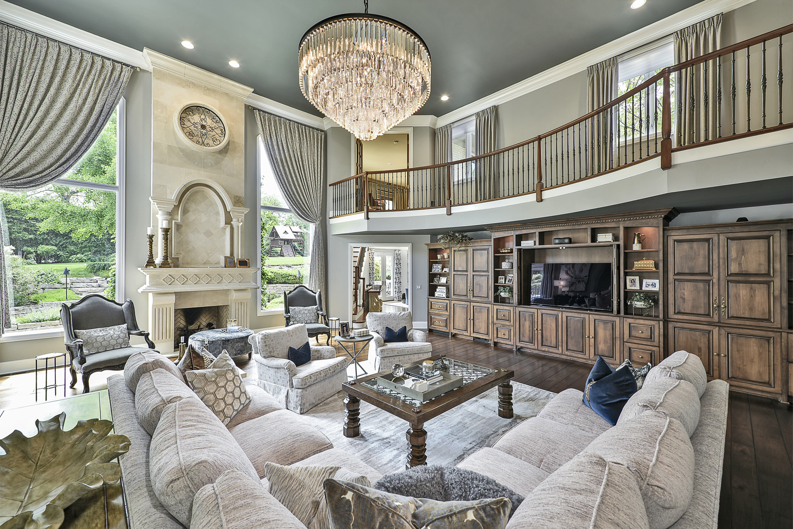 1877 Banbury Road Inverness, IL 60067 - Photo 16 of 59 a living room with furniture a fireplace and lots of windows