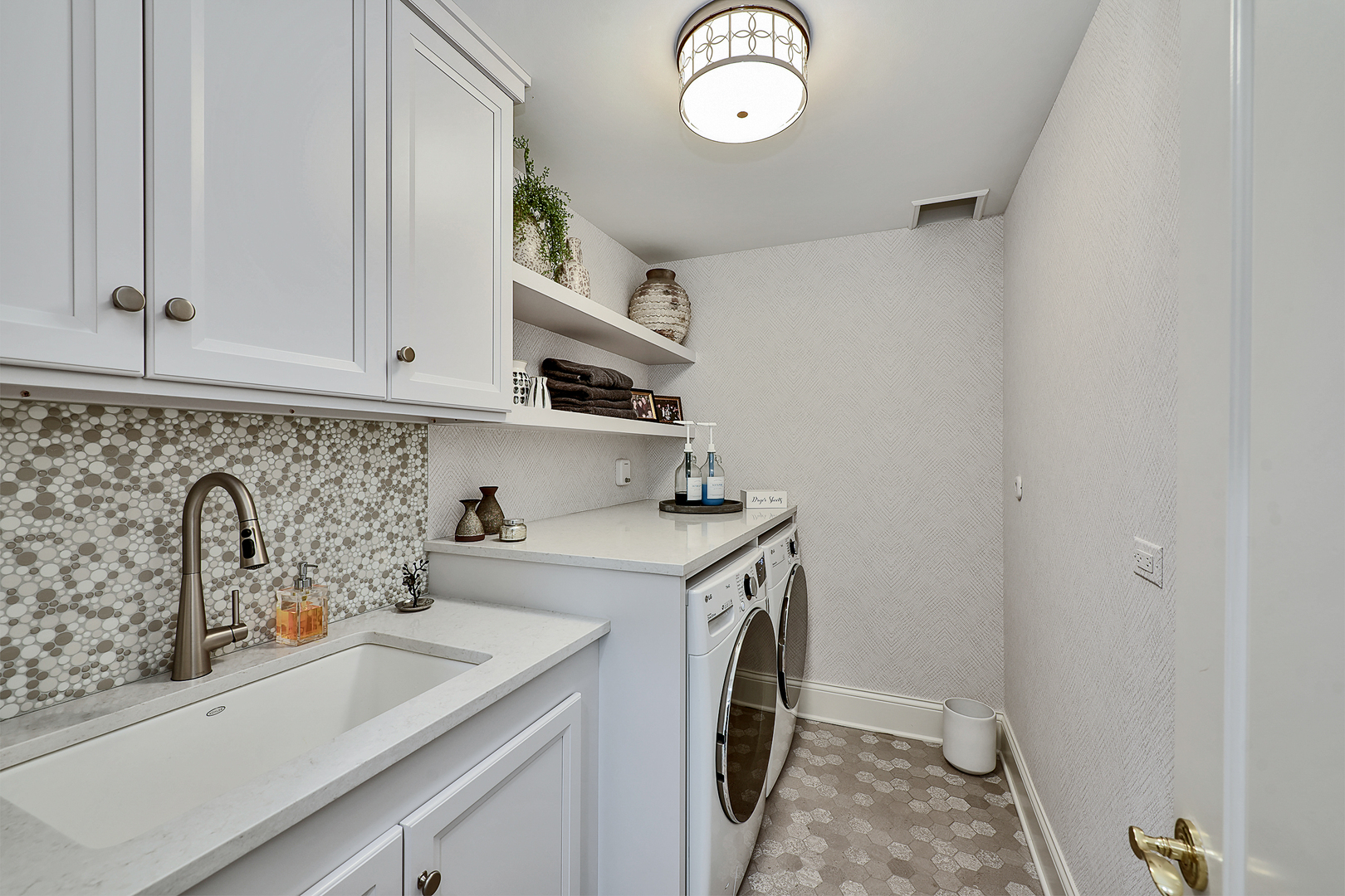 1877 Banbury Road Inverness, IL 60067 - Photo 23 of 59 a view of a kitchen with sink and washing machine