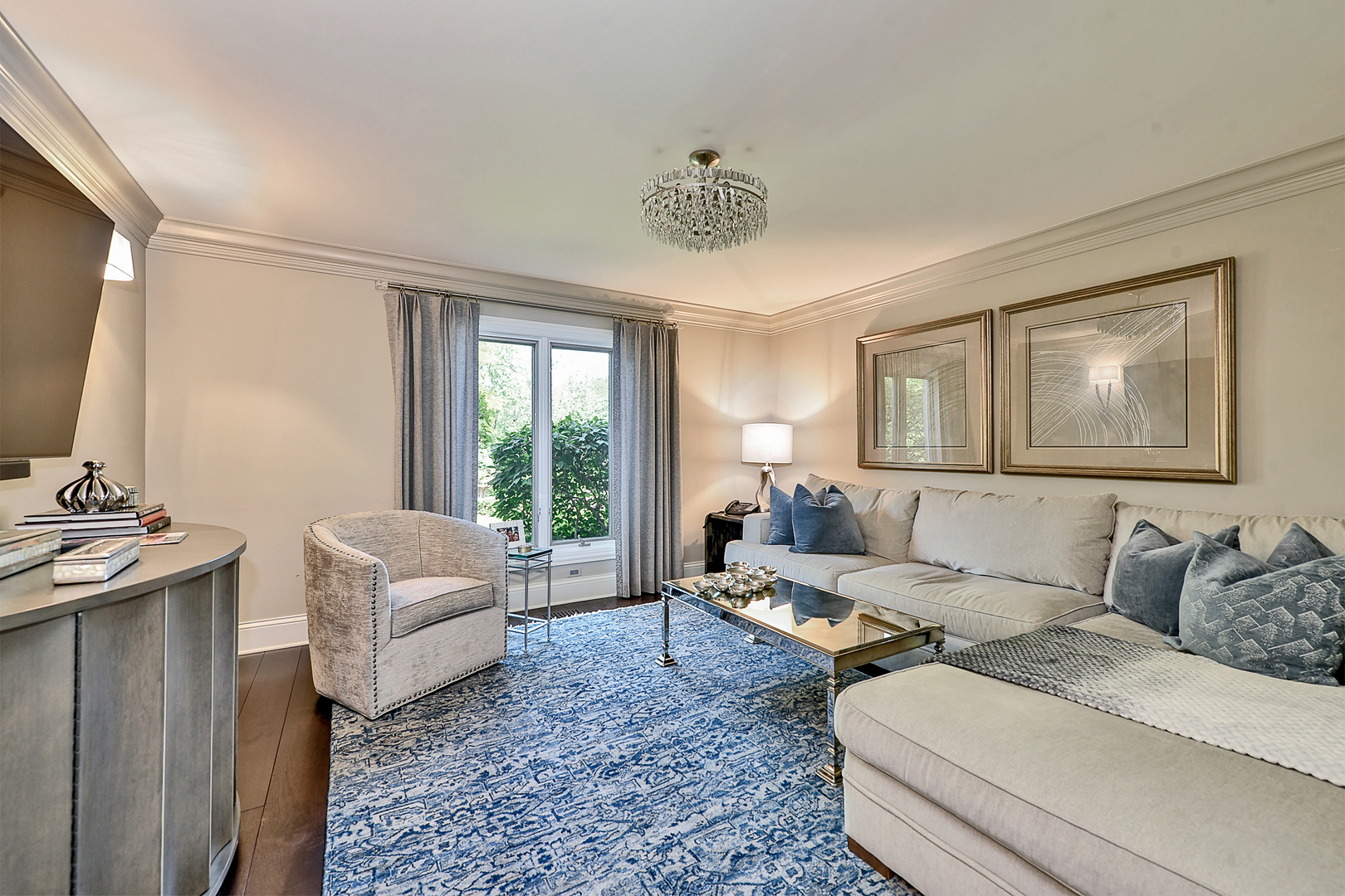 1877 Banbury Road Inverness, IL 60067 - Photo 24 of 59 a living room with furniture and a flat screen tv