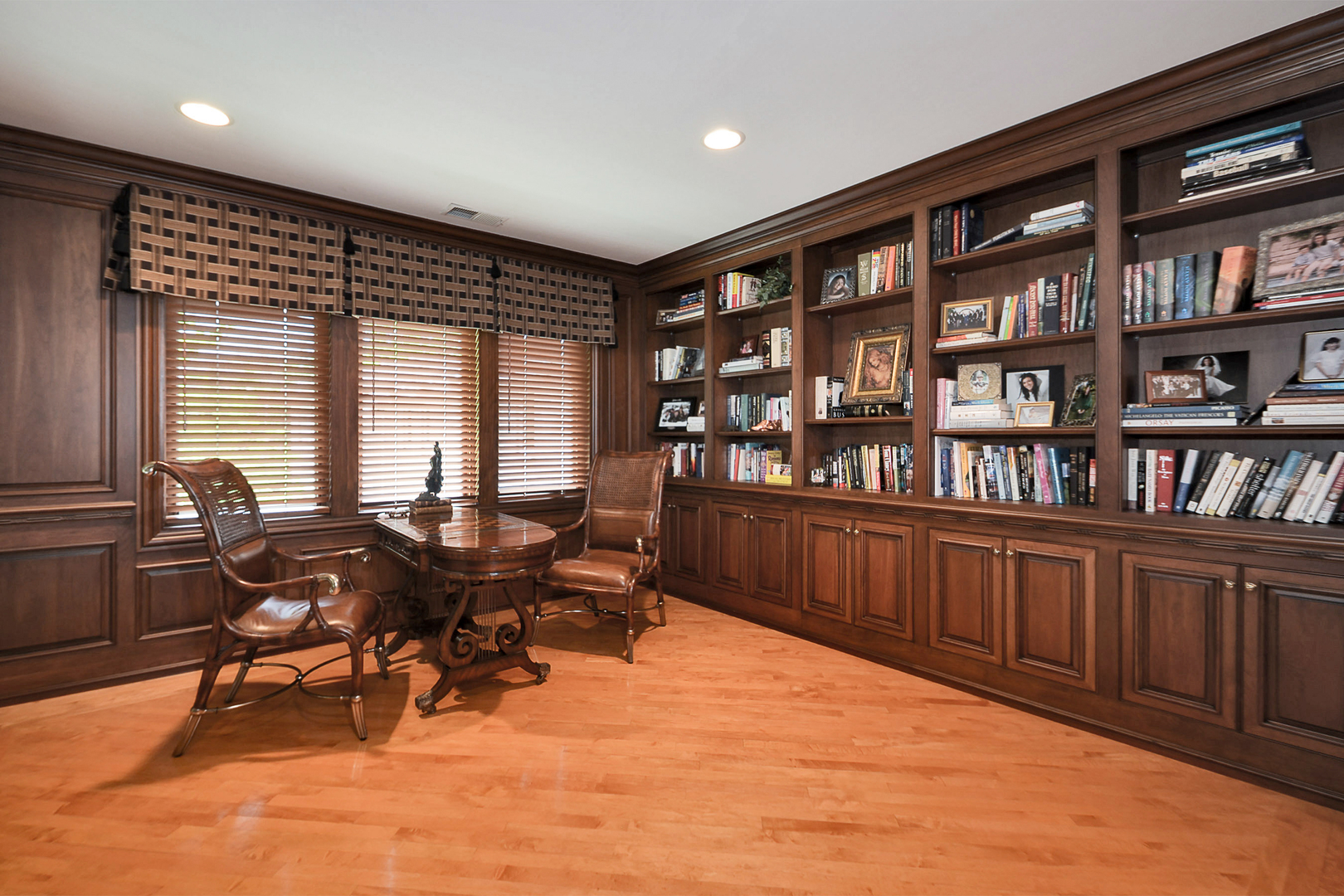 1877 Banbury Road Inverness, IL 60067 - Photo 25 of 59 a view of a workspace with furniture and a bookshelf