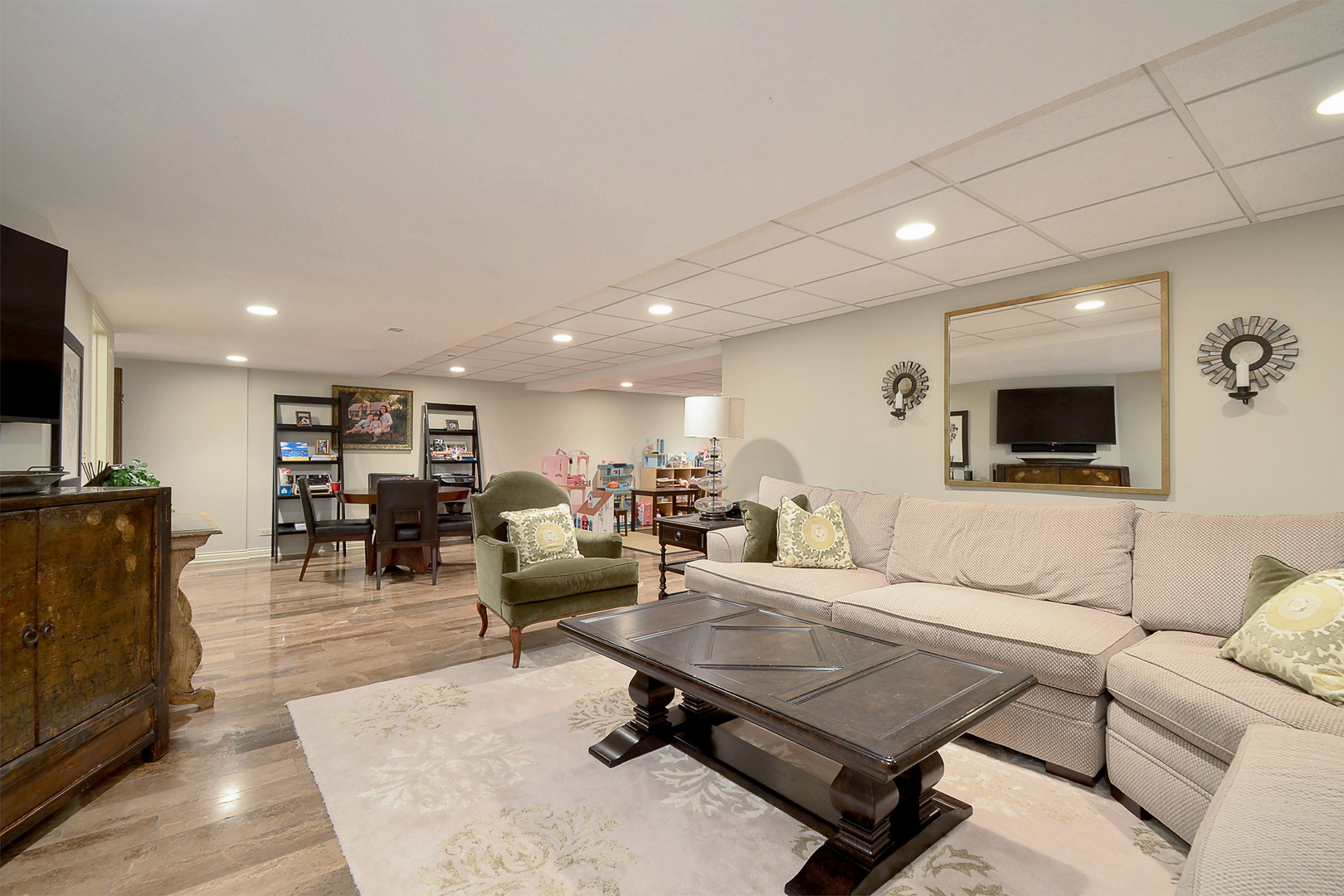1877 Banbury Road Inverness, IL 60067 - Photo 40 of 59 a living room with furniture and a flat screen tv