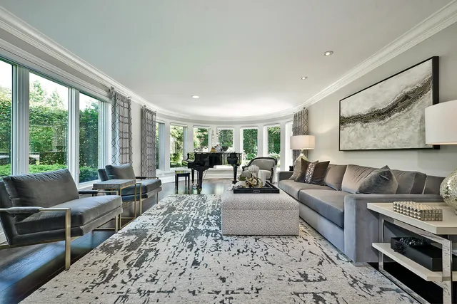 a kitchen with kitchen island a dining table chairs sink and wooden floor