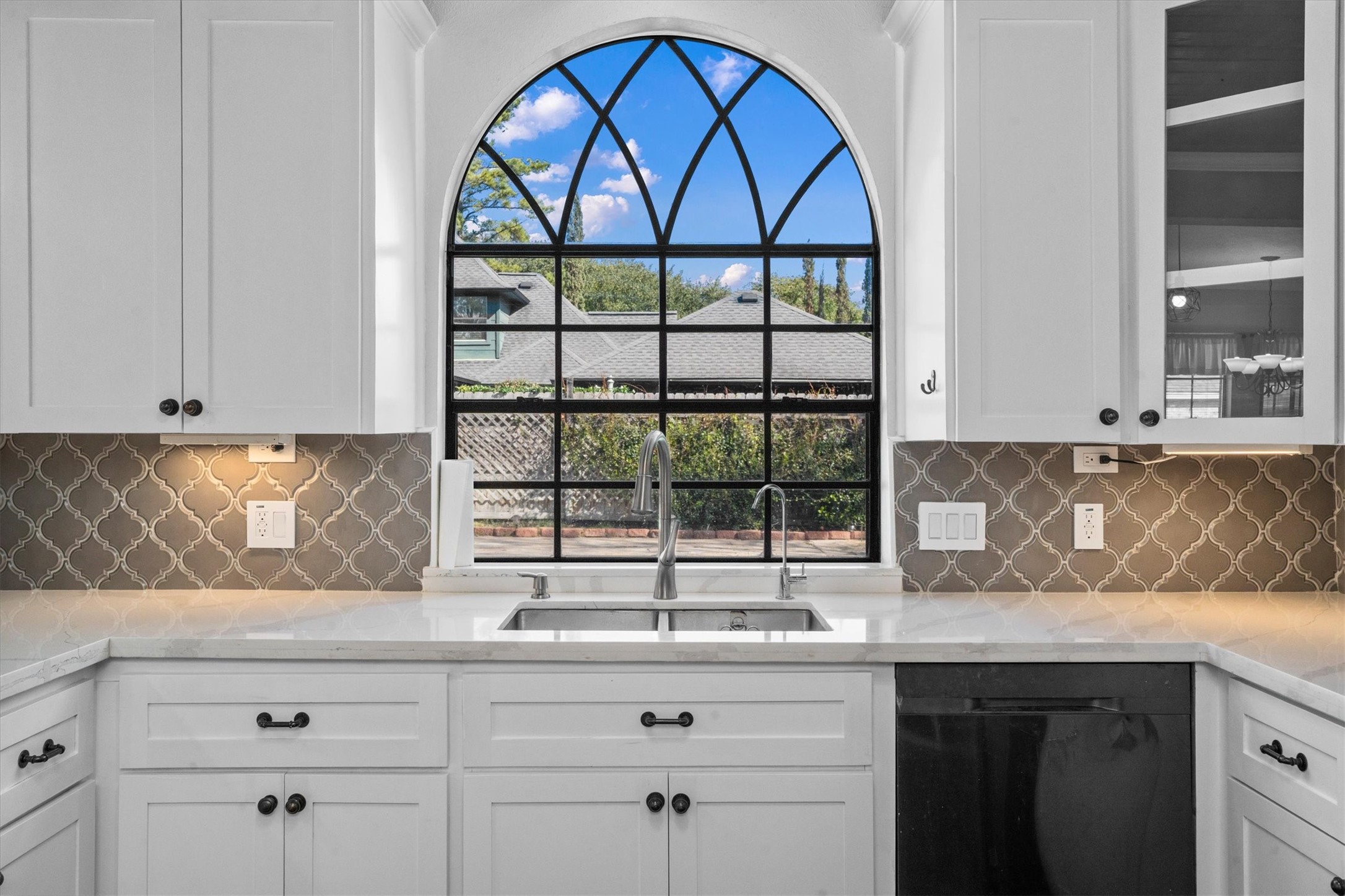 10402 Hondo Hill Road Houston, TX 77064 - Photo 11 of 40 a kitchen with a sink and a window