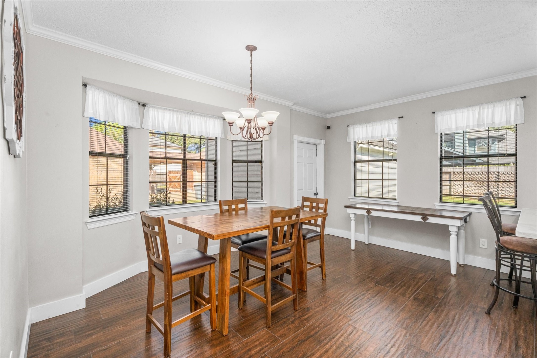 10402 Hondo Hill Road Houston, TX 77064 - Photo 13 of 40 a view of a dining room with furniture windows and wooden floor