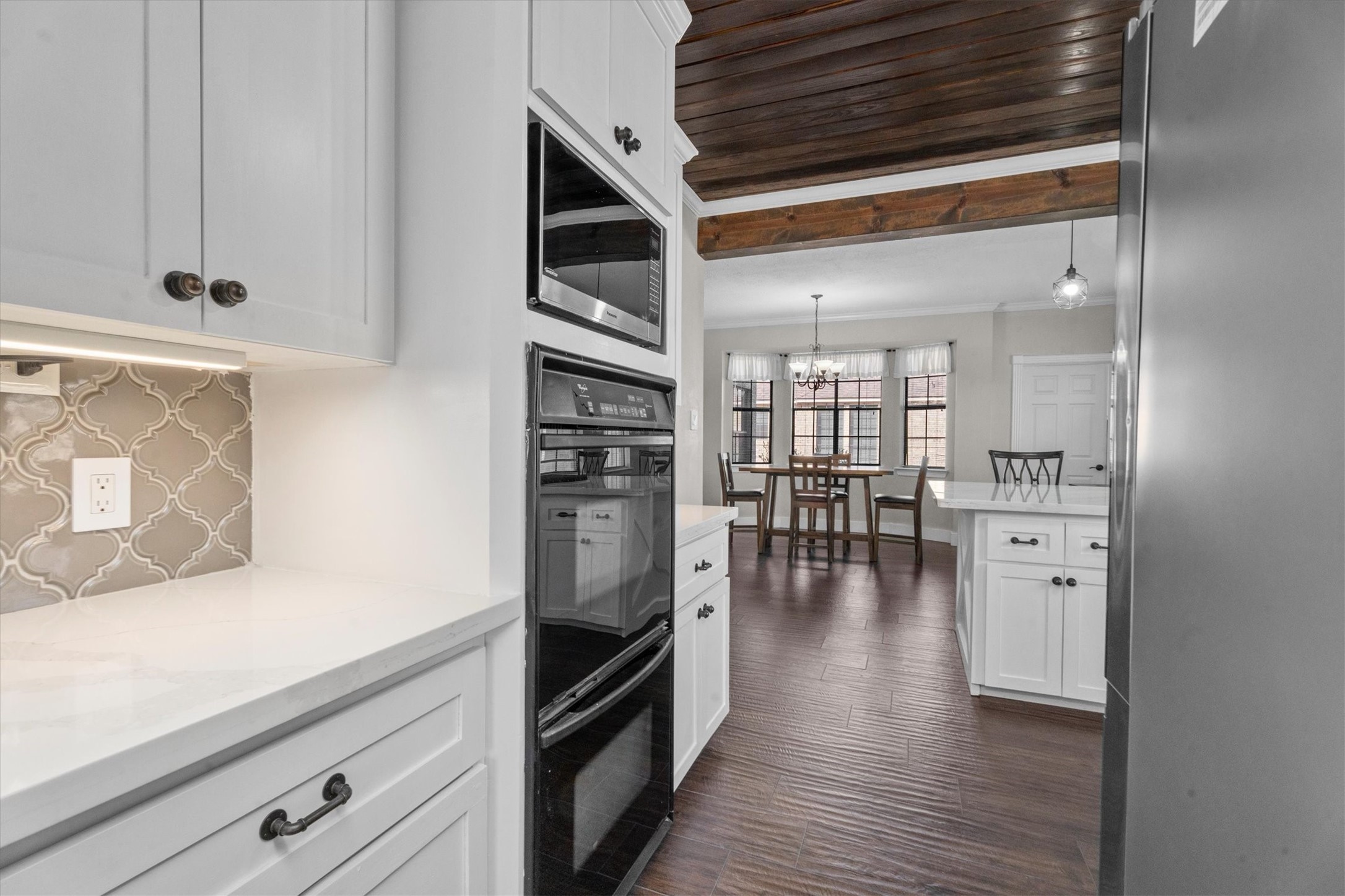 10402 Hondo Hill Road Houston, TX 77064 - Photo 17 of 40 a view of a kitchen with wooden floor and a window