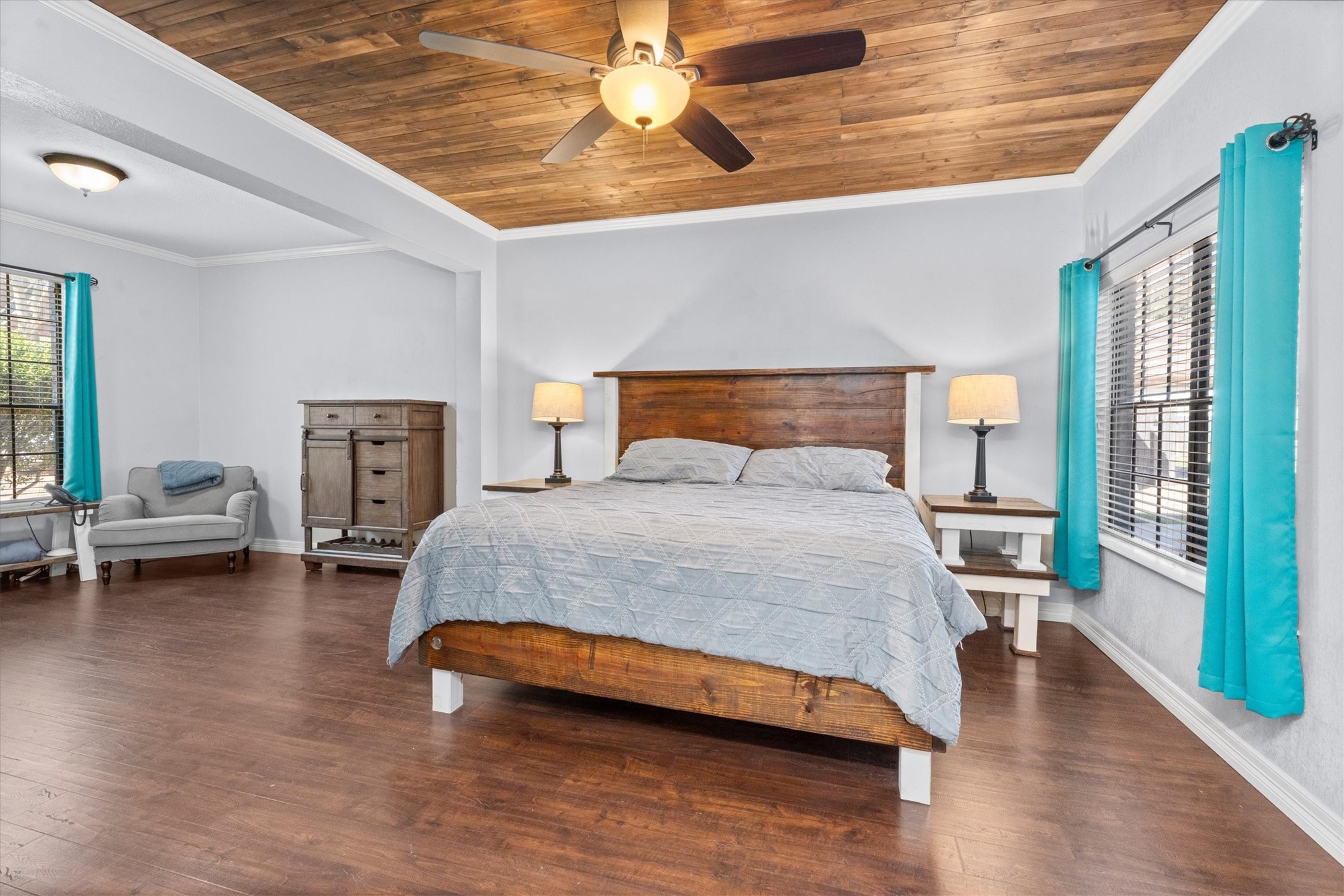 10402 Hondo Hill Road Houston, TX 77064 - Photo 22 of 40 a bedroom with a bed and wooden floor
