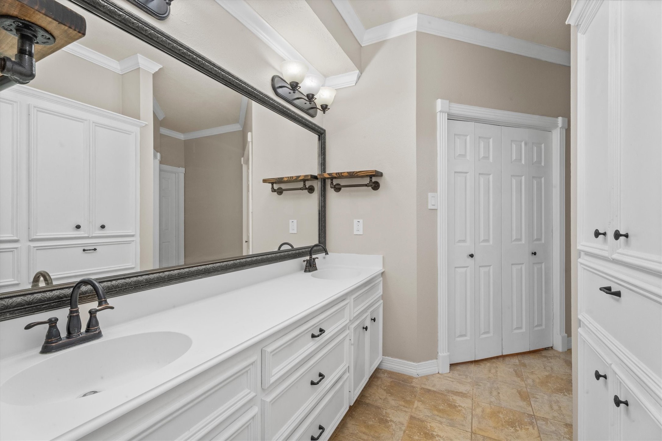 10402 Hondo Hill Road Houston, TX 77064 - Photo 23 of 40 a bathroom with a sink and a mirror