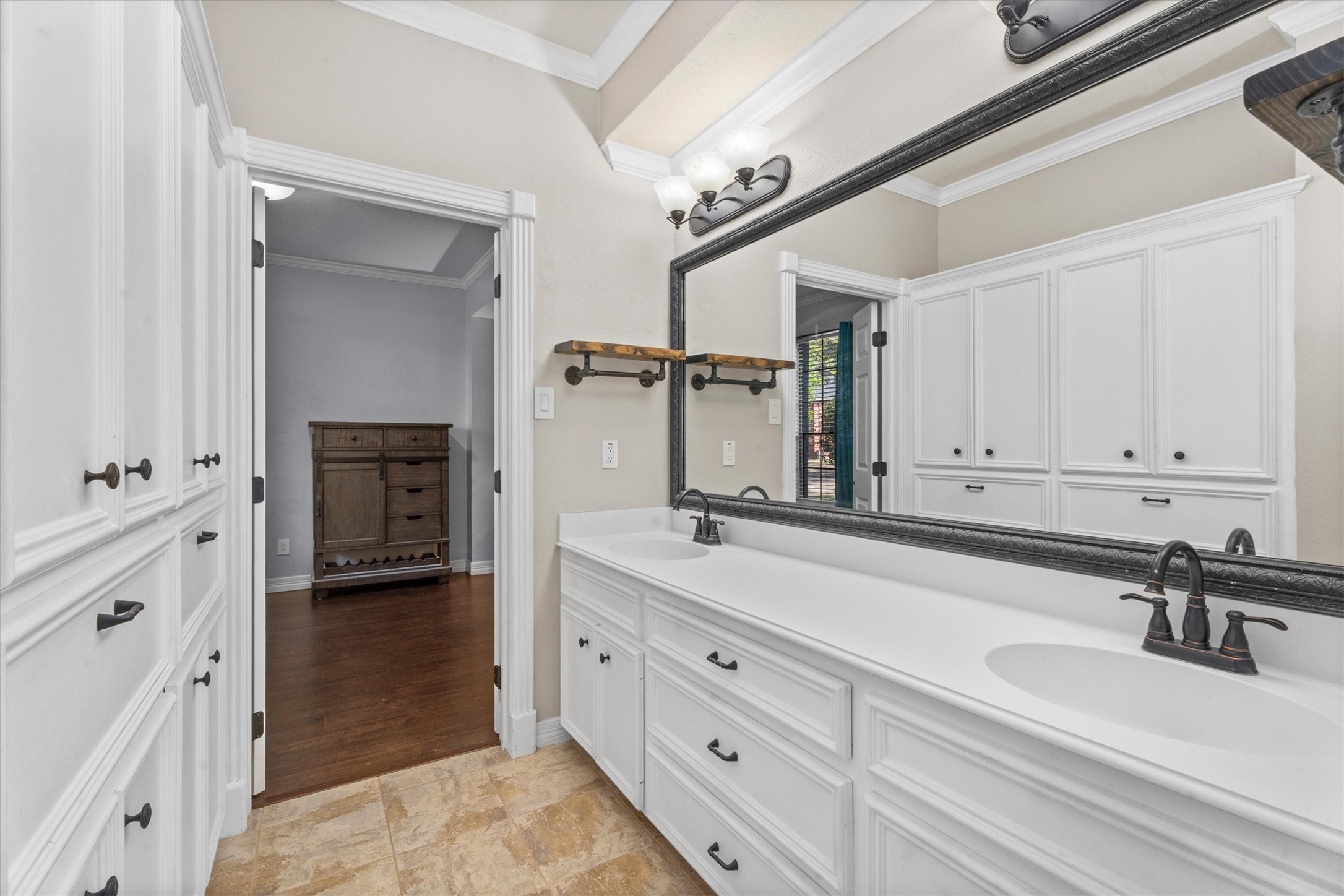 10402 Hondo Hill Road Houston, TX 77064 - Photo 24 of 40 a spacious bathroom with double sink a and a mirror
