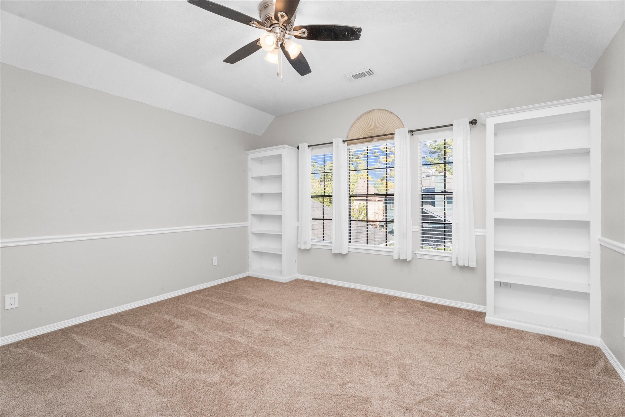 10402 Hondo Hill Road Houston, TX 77064 - Photo 30 of 40 a view of an empty room with a window and a kitchen