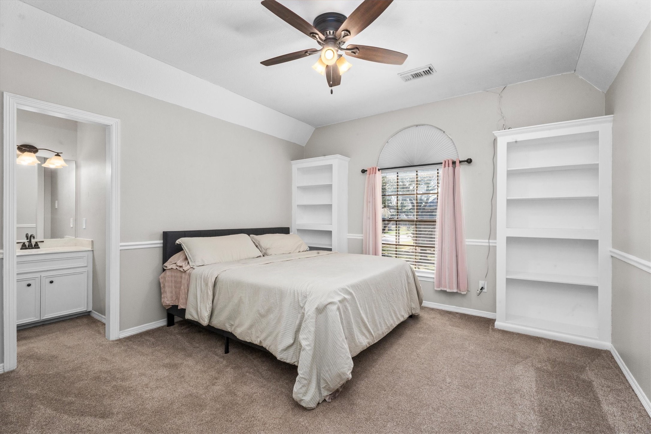 10402 Hondo Hill Road Houston, TX 77064 - Photo 35 of 40 a bed room with a bed and a ceiling fan