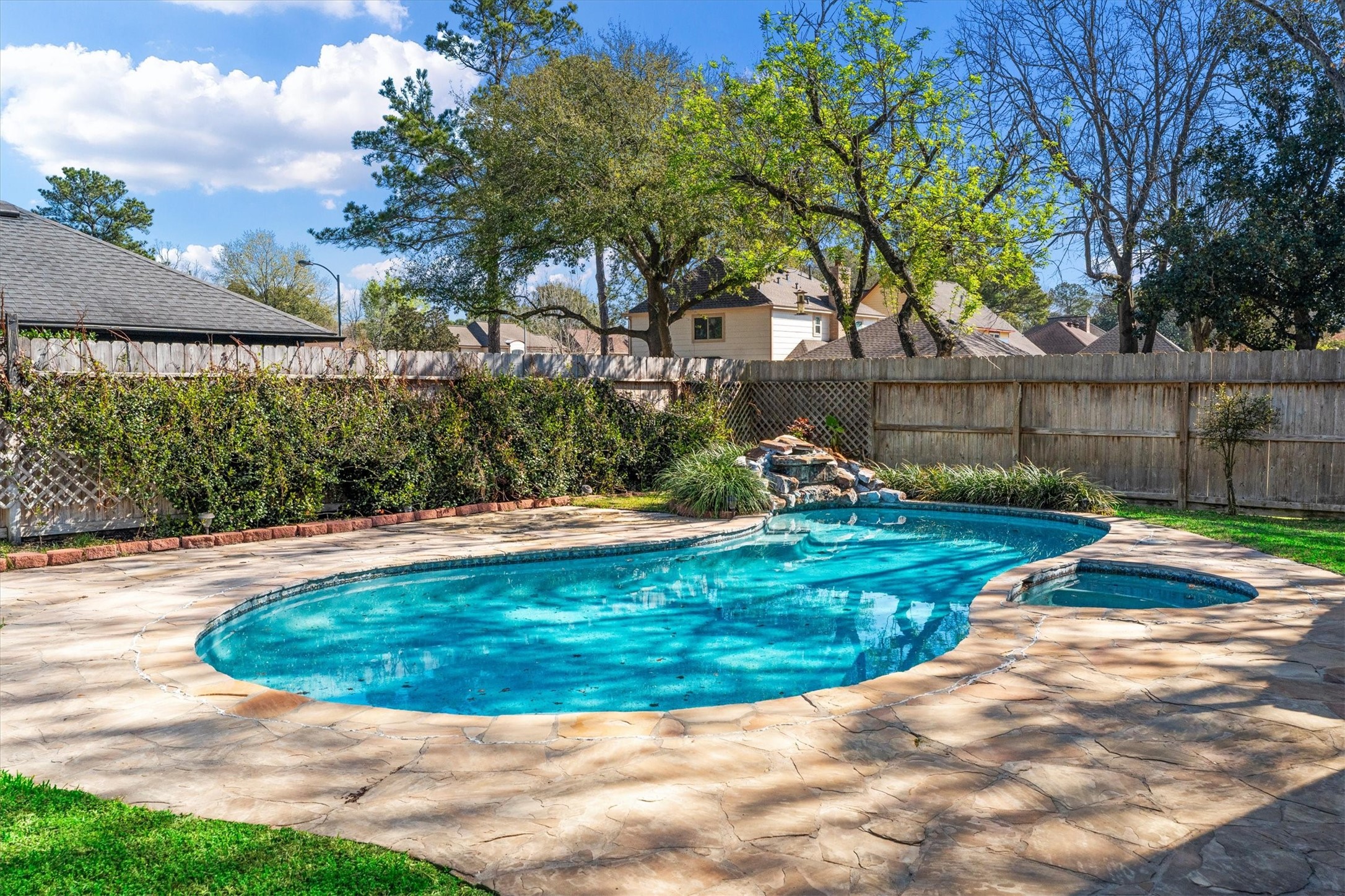 10402 Hondo Hill Road Houston, TX 77064 - Photo 36 of 40 a view of a backyard with a garden