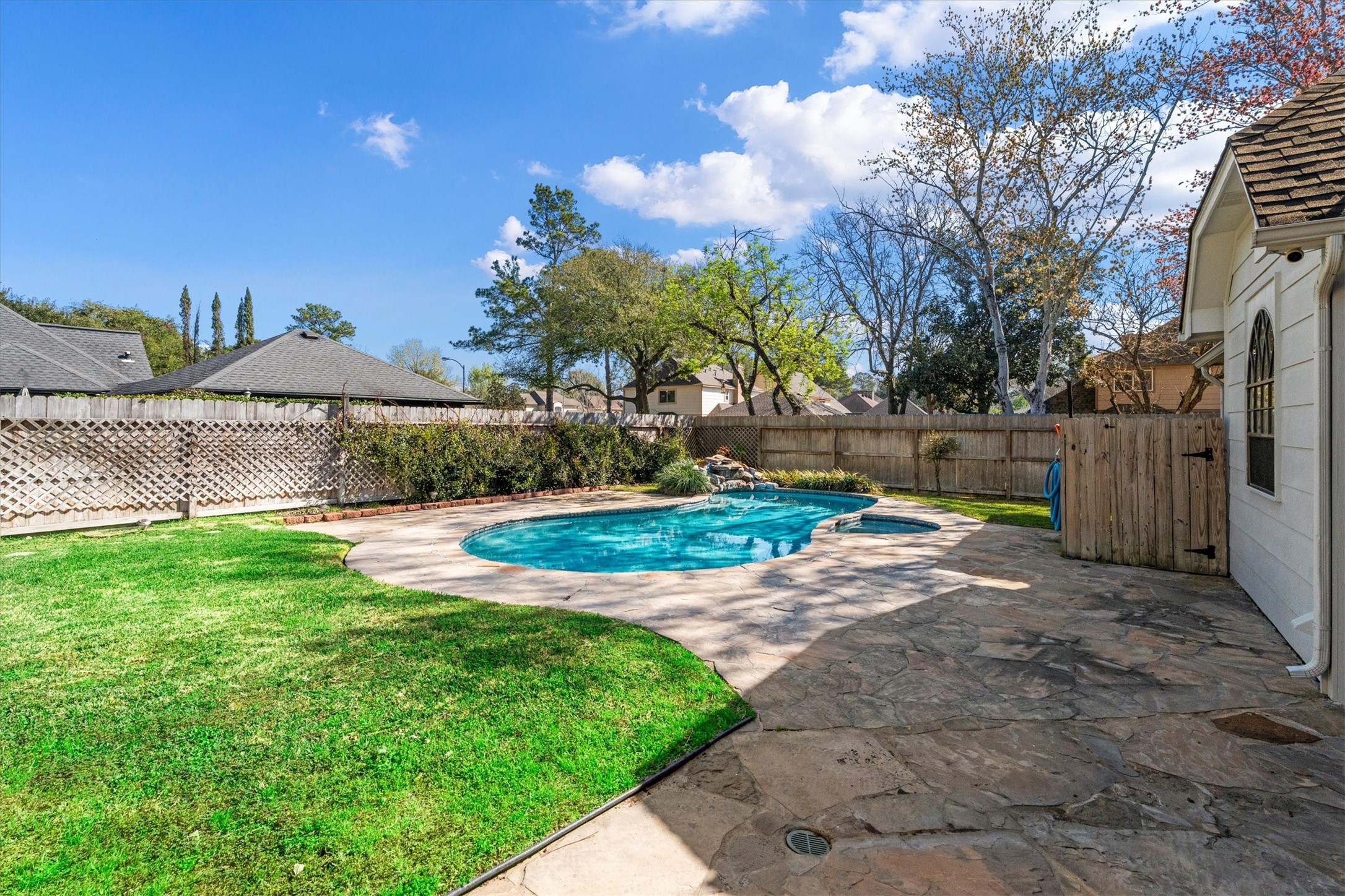 10402 Hondo Hill Road Houston, TX 77064 - Photo 39 of 40 a view of a backyard with a garden and tree