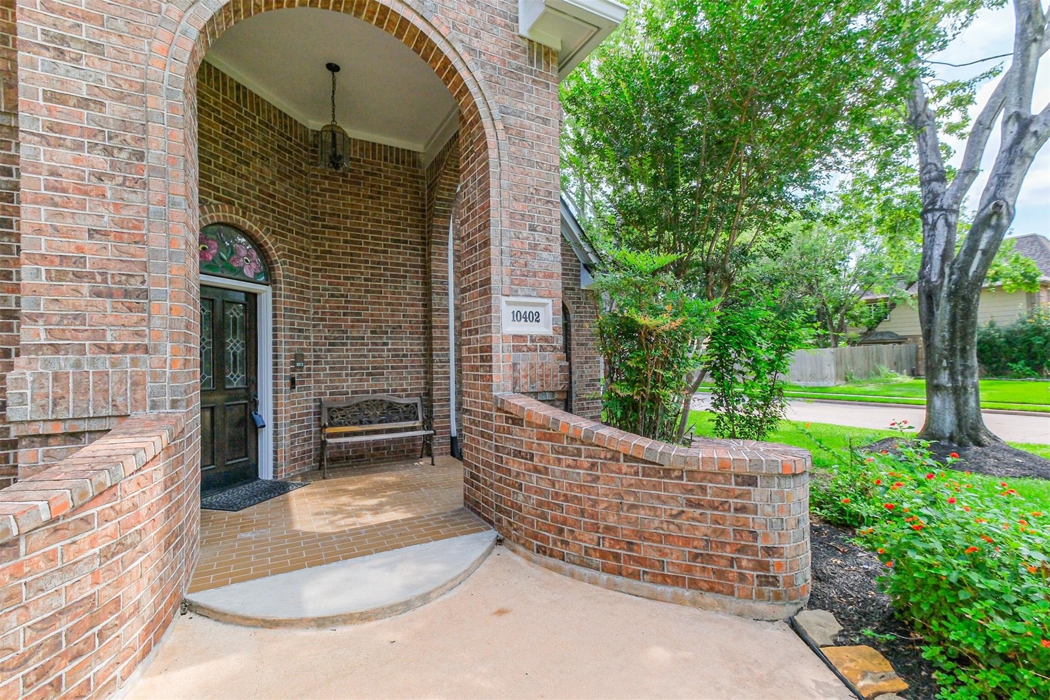 10402 Hondo Hill Road Houston, TX 77064 - Photo 4 of 40 a view of a wooden door with a trees