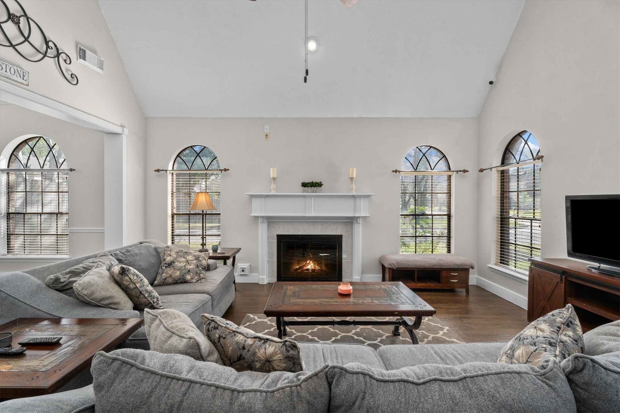 10402 Hondo Hill Road Houston, TX 77064 - Photo 6 of 40 a living room with furniture a flat screen tv and a fireplace