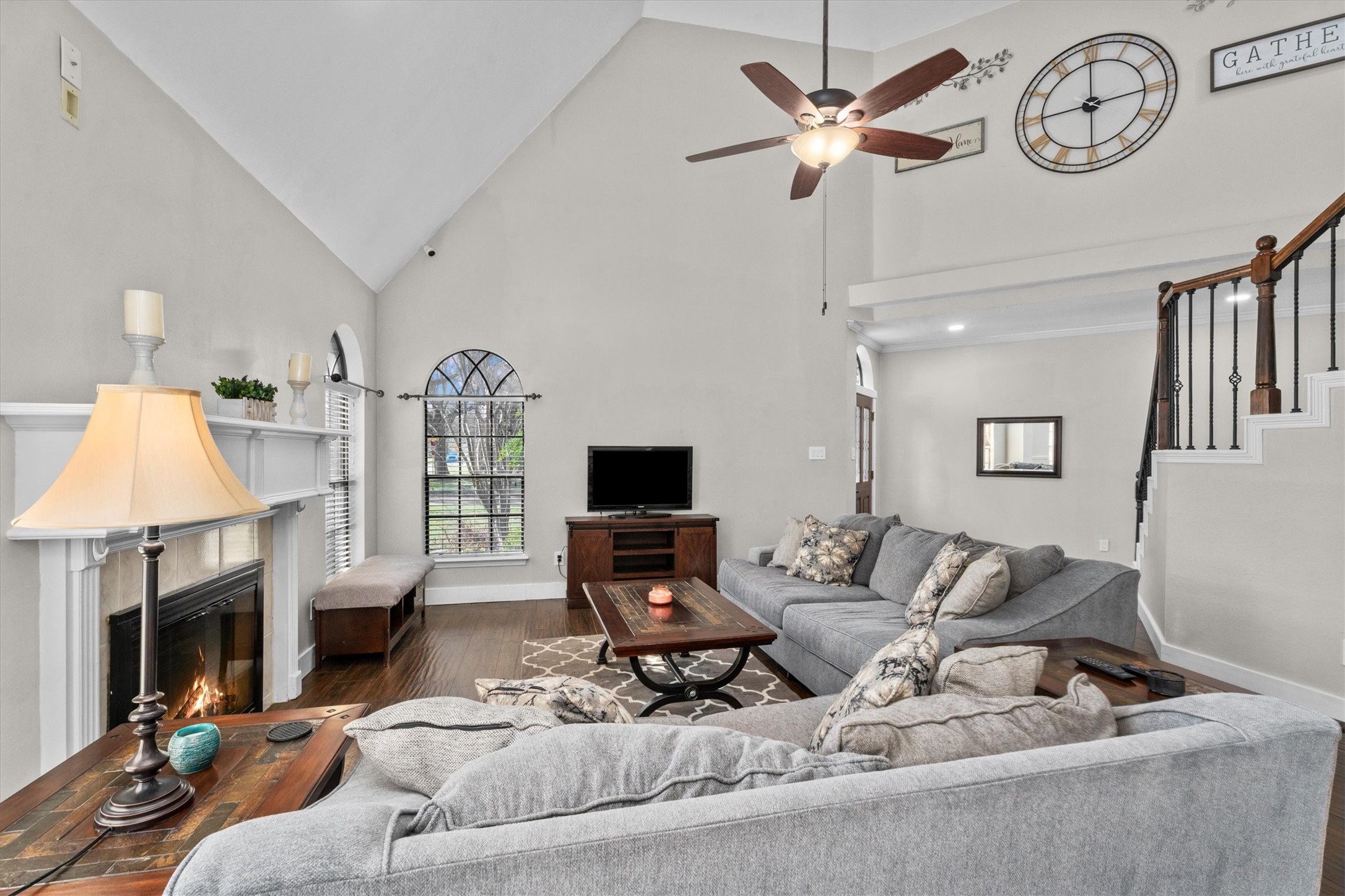 10402 Hondo Hill Road Houston, TX 77064 - Photo 8 of 40 a living room with furniture a fireplace and a large window