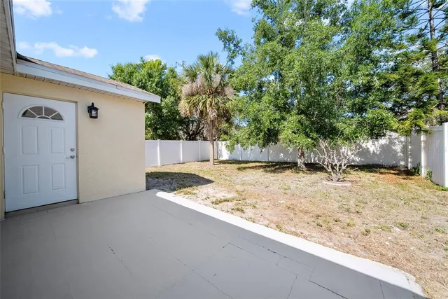 a view of a backyard of the house