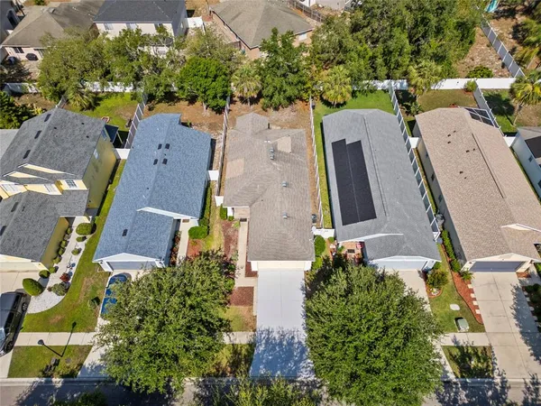 an aerial view of residential houses with outdoor space
