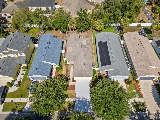 an aerial view of residential houses with outdoor space