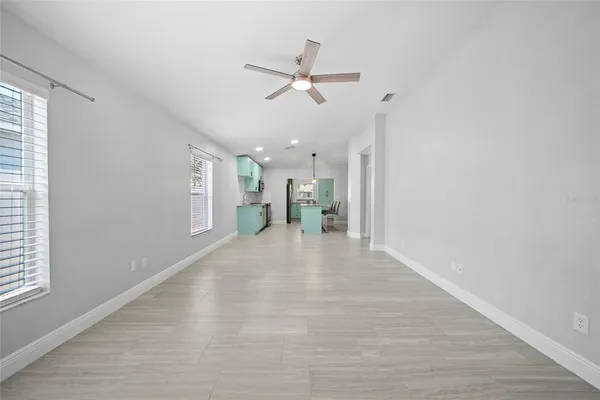 a view of an empty room with a window