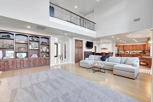 a kitchen with stainless steel appliances granite countertop a sink and a stove