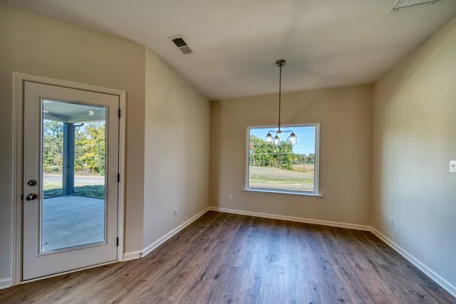 a view of kitchen with kitchen island microwave and stove