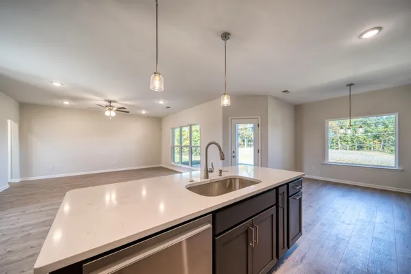 a stove top oven sitting inside of a kitchen