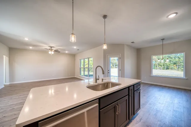 a stove top oven sitting inside of a kitchen