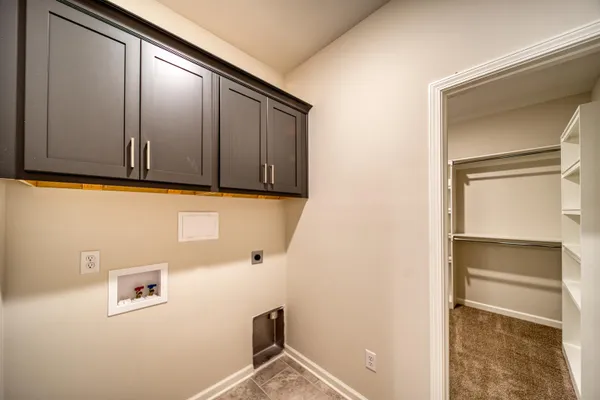 a kitchen with kitchen island a sink appliances and a counter top space