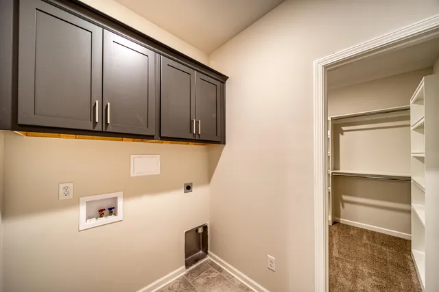 a kitchen with kitchen island a sink appliances and a counter top space