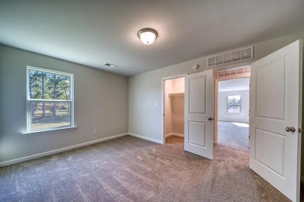 a bathroom with a granite countertop sink mirror and shower